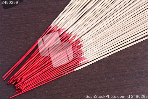 Image of Incense aromatic sticks on the wooden background