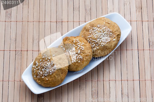 Image of sweet cakes with sesame seeds on a plate