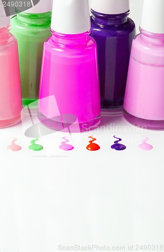 Image of Bottles with spilled nail polish