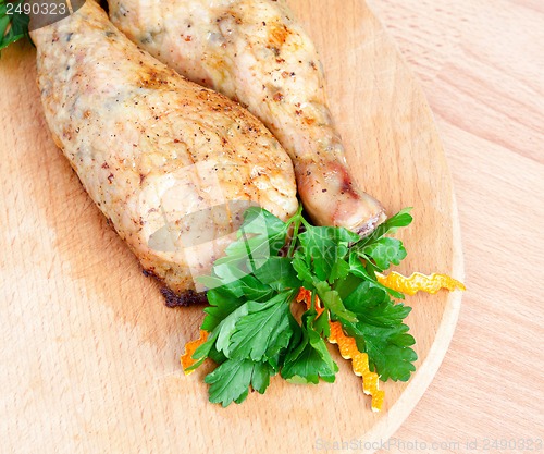 Image of Fried chicken legs with parsley on the board