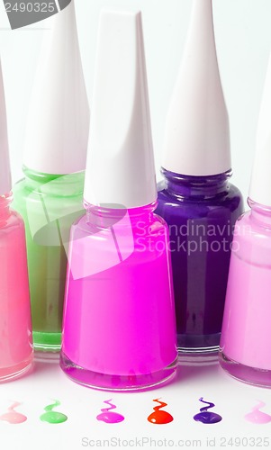 Image of Bottles with spilled nail polish