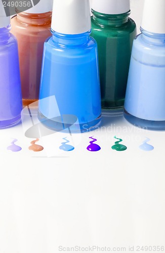 Image of Bottles with spilled nail polish