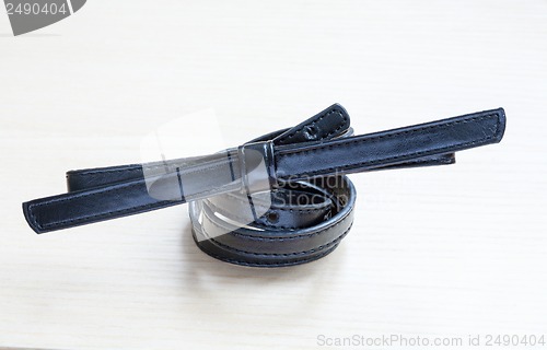 Image of object on wooden background - waist-belt close up