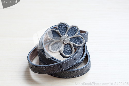 Image of object on wooden background - waist-belt close up