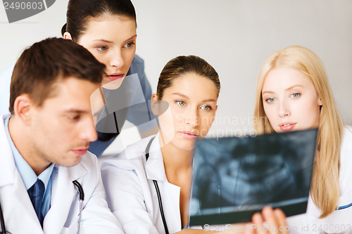 Image of group of doctors looking at x-ray