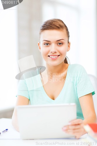 Image of smiling student girl with tablet pc