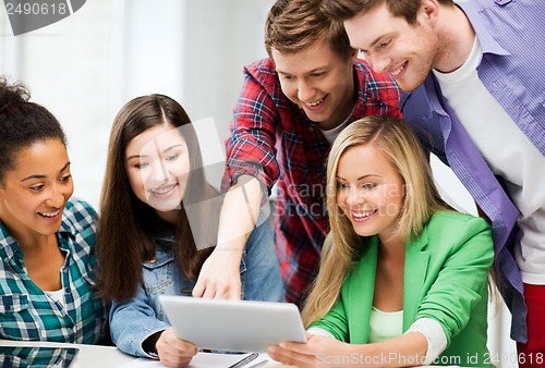 Image of students looking at tablet pc in lecture at school