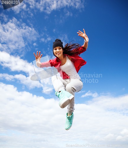 Image of beautiful dancing girl jumping