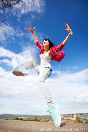 Image of beautiful dancing girl jumping