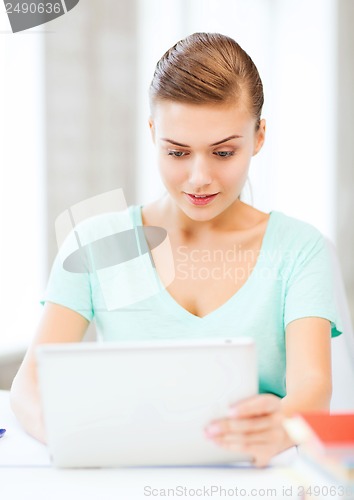 Image of smiling student girl with tablet pc