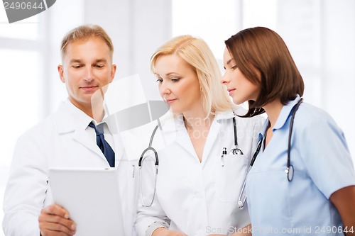 Image of doctors looking at tablet pc