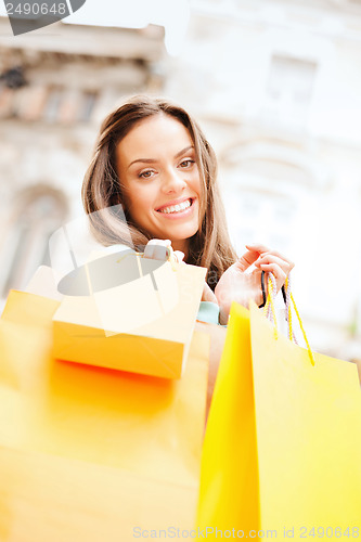 Image of woman with shopping bags in ctiy