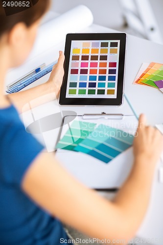 Image of woman working with color samples for selection