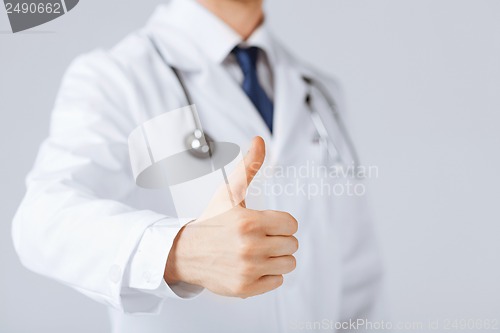 Image of male doctor hand showing thumbs up