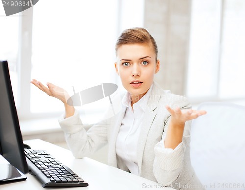 Image of stressed businesswoman with computer