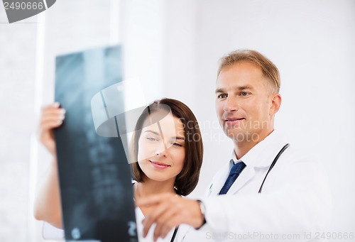 Image of two doctors looking at x-ray