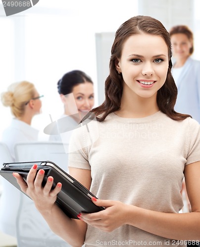 Image of businesswoman with tablet pc in office