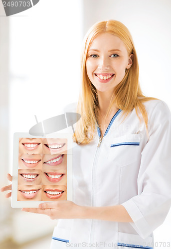 Image of female doctor with tablet pc and smiles