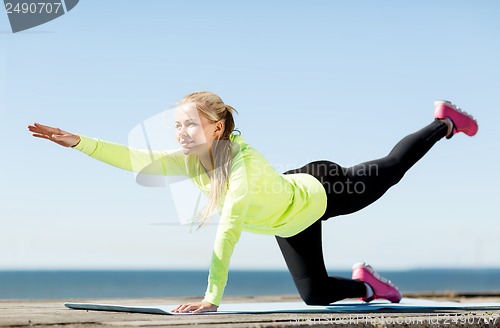 Image of woman doing sports outdoors