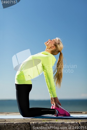 Image of woman doing sports outdoors