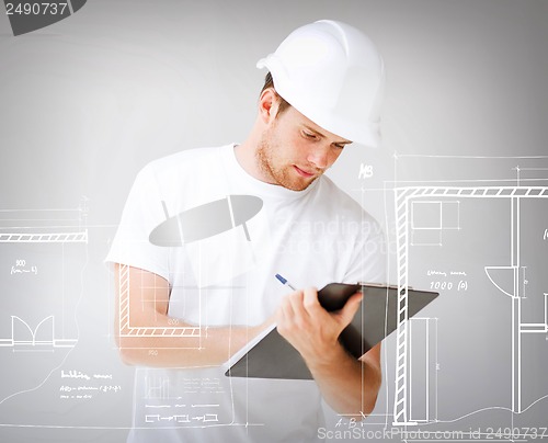 Image of male architect looking at blueprint