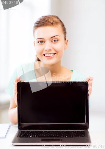 Image of smiling student girl with laptop