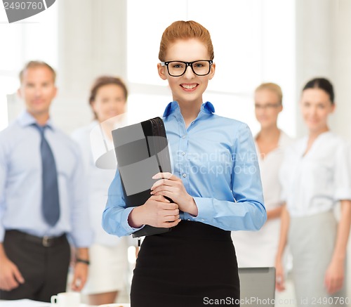 Image of businesswoman with tablet pc in office