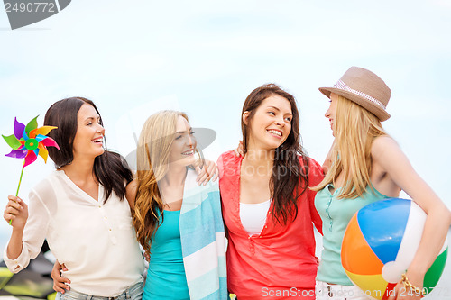 Image of girls with ball on the beach