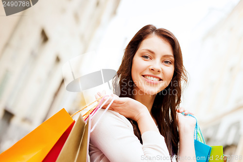 Image of woman with shopping bags in ctiy