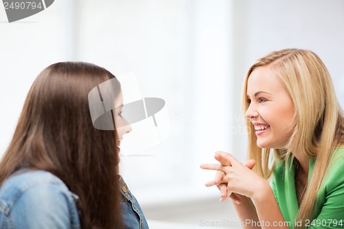 Image of student girls gossiping at school