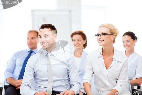 Image of businessmen and businesswomen on conference