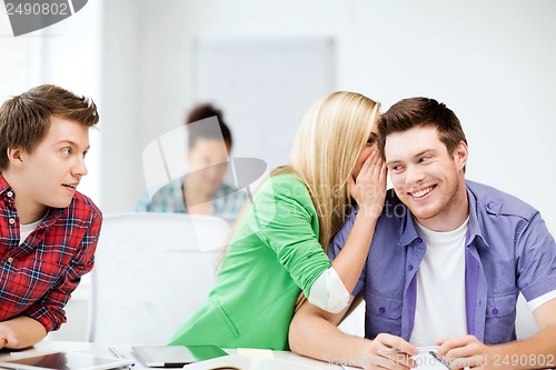 Image of group of students gossiping at school