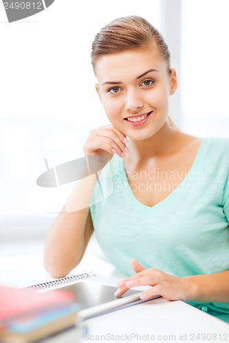 Image of smiling student girl with tablet pc