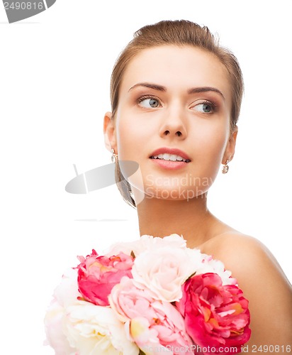 Image of woman with diamond earrings and flowers