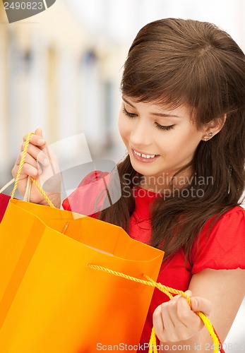 Image of woman with shopping bags in ctiy