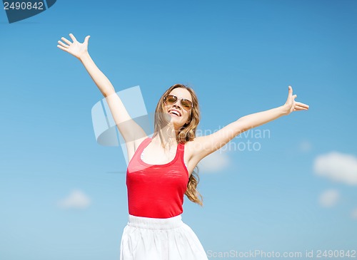 Image of girl standing on the beach