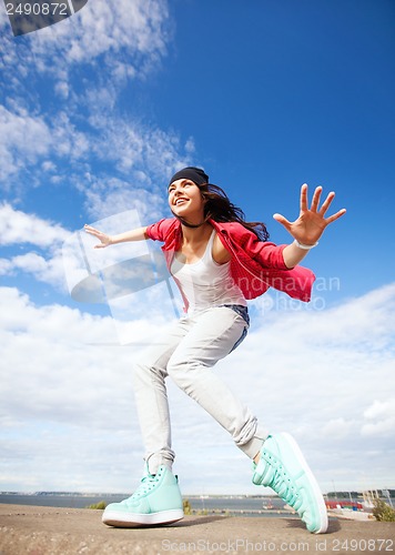 Image of beautiful dancing girl in movement