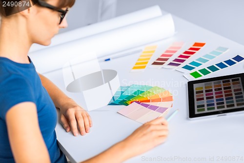 Image of woman working with color samples for selection