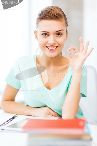 Image of smiling student girl with tablet pc
