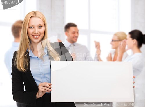 Image of businesswoman with white blank board