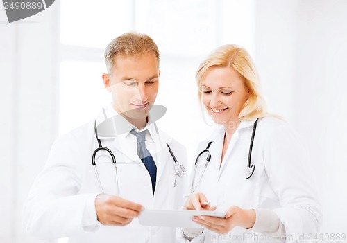 Image of two doctors looking at tablet pc