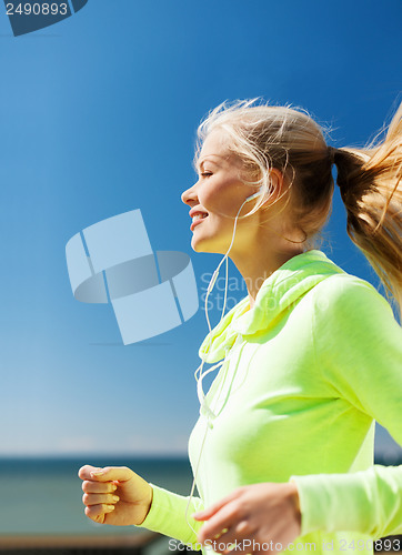 Image of woman doing running outdoors