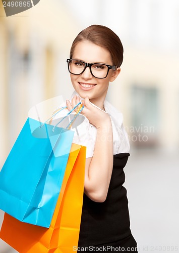 Image of woman with shopping bags in ctiy