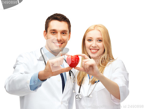 Image of doctors cardiologists with heart