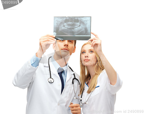 Image of two doctors dentists looking at x-ray
