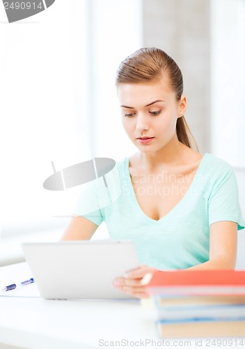 Image of smiling student girl with tablet pc