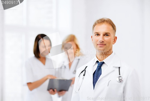 Image of male doctor with colleagues