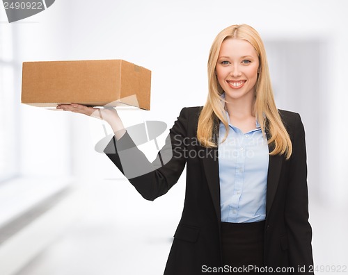 Image of businesswoman delivering cardboard box