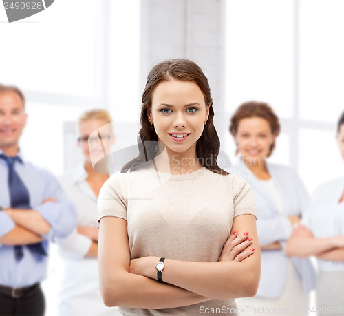 Image of attractive young businesswoman in office