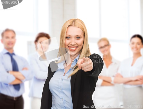 Image of attractive young businesswoman in office